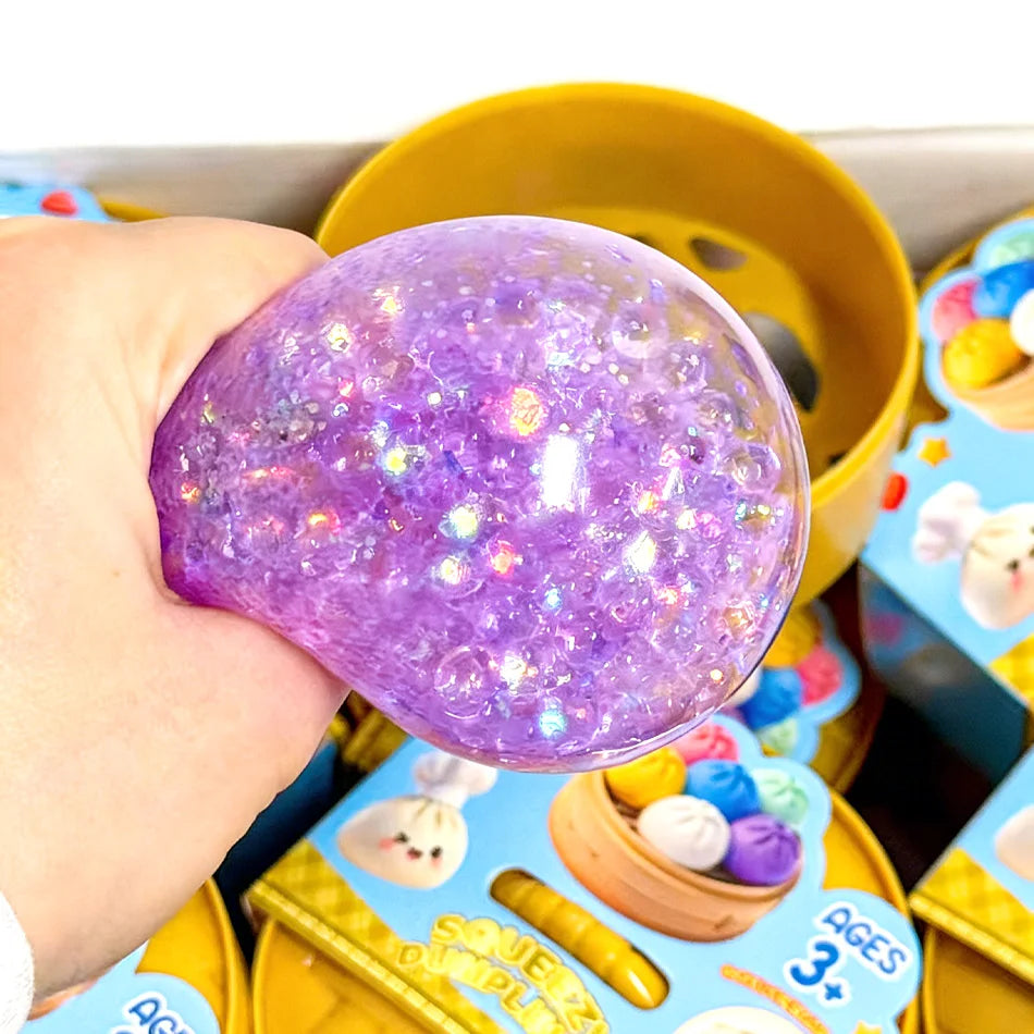 1 pc Pick your favorite color or enjoy a fun surprise with a random color! Glitter Dumpling Squishy